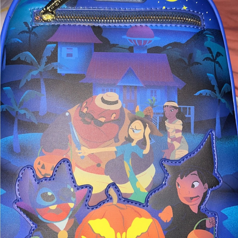 Loungefly Blue and Purple Backpack Glows in the Dark